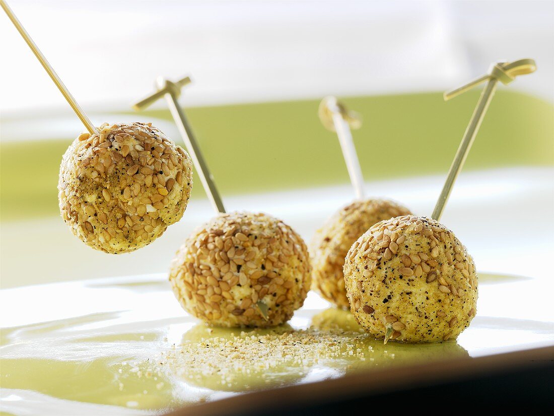 Balls of fresh goat's cheese with sesame seeds