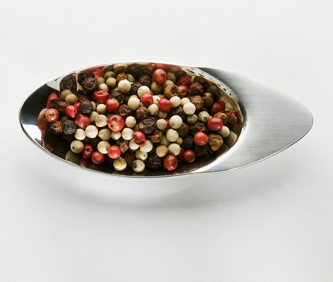 Mixed peppercorns in a small dish