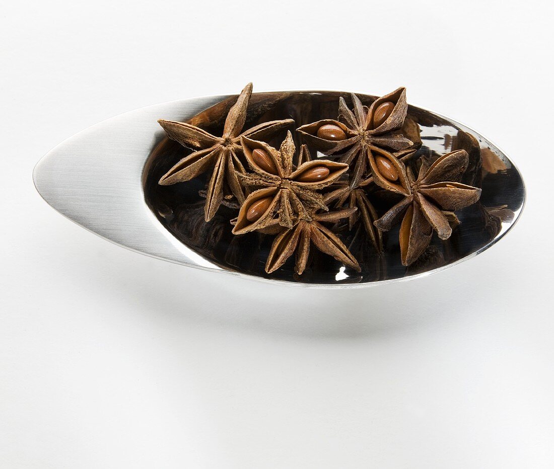 Star anise in a small metal dish