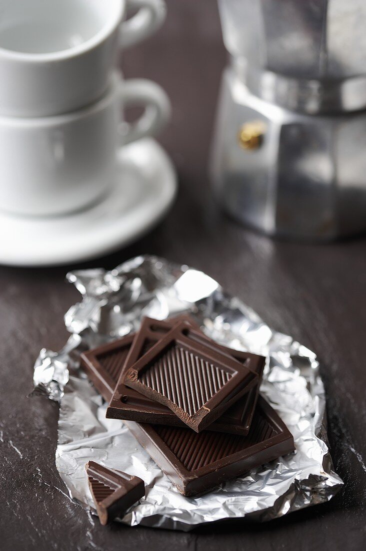 Pieces of milk chocolate on silver paper