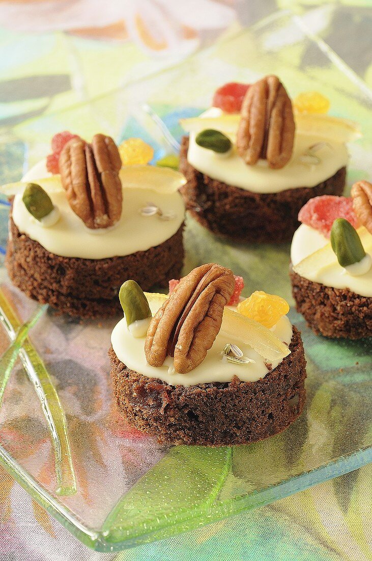 Four small chocolate cakes with nuts and dried fruit