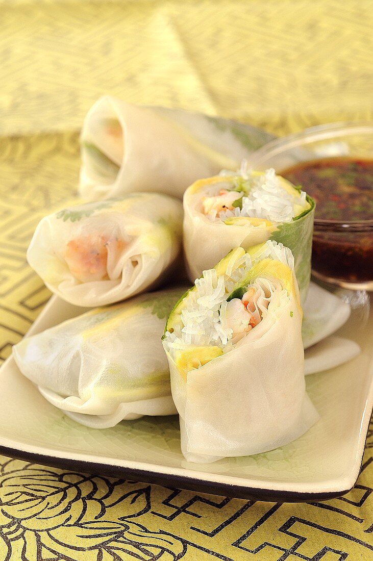 Rice paper rolls filled with pineapple, avocado & shrimps