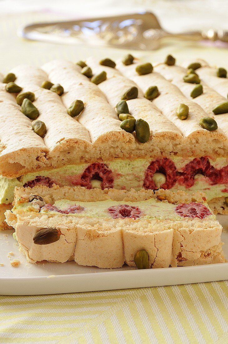 Meringue cake with raspberry and pistachio filling