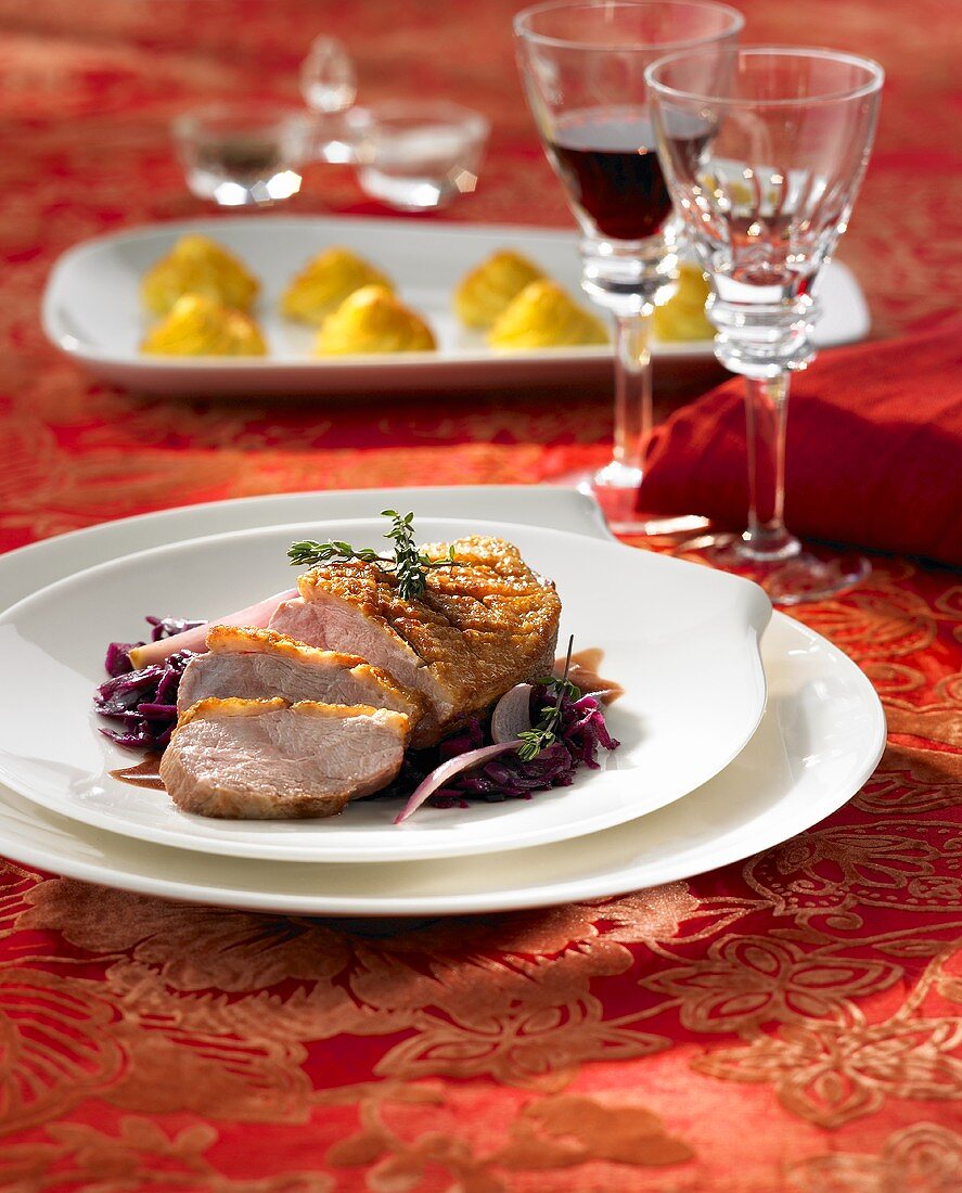 Duck breast with red wine shallot sauce on red cabbage