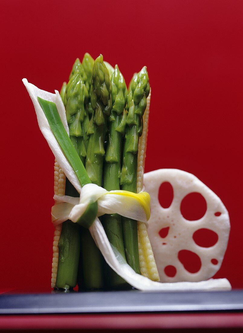 Green asparagus with baby sweetcorn & a slice of lotus root