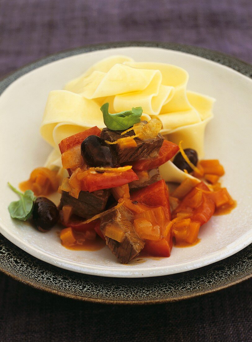 Quick venison ragout with peppers, olives and ribbon pasta