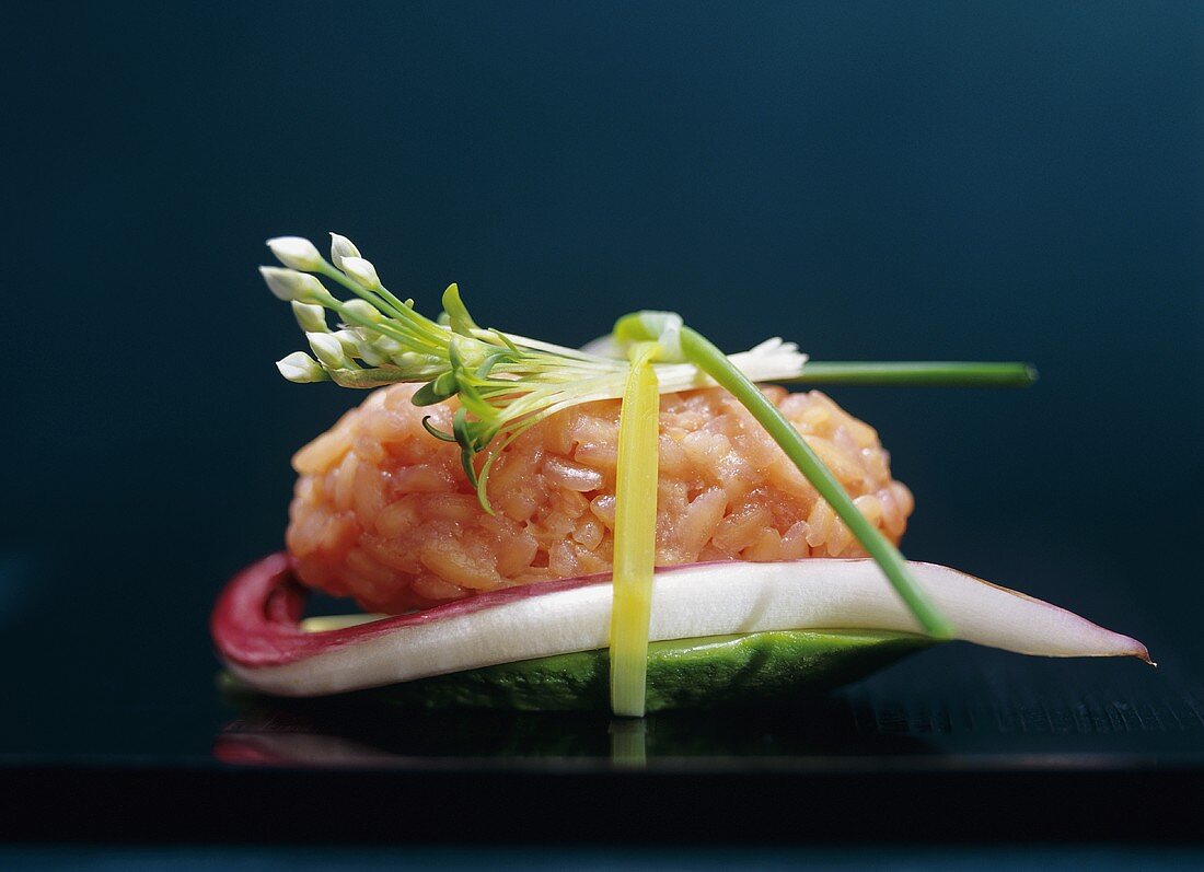 Salmon rice with chive flower, cress, radicchio, avocado