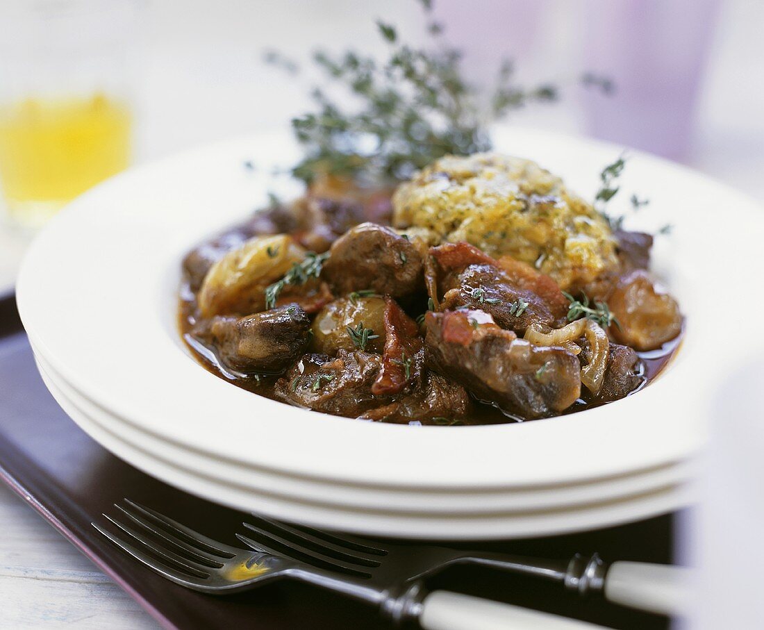 Beef and bacon ragout with herb dumpling