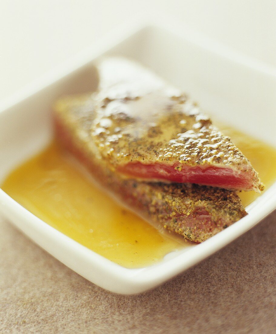 Tuna with spice crust in honey sauce