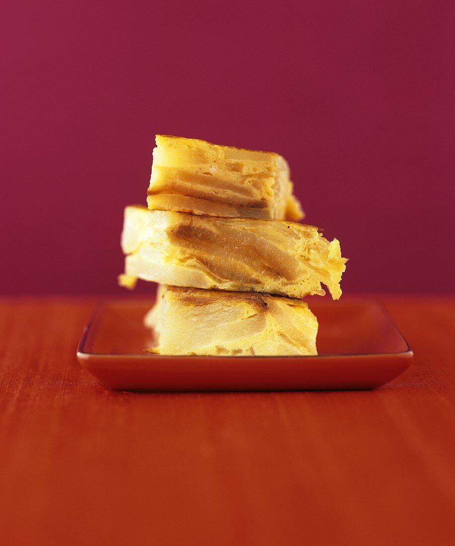 Three pieces of pear cake, stacked