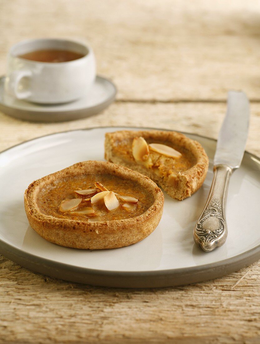 Small wholemeal pumpkin tarts with a cup of tea