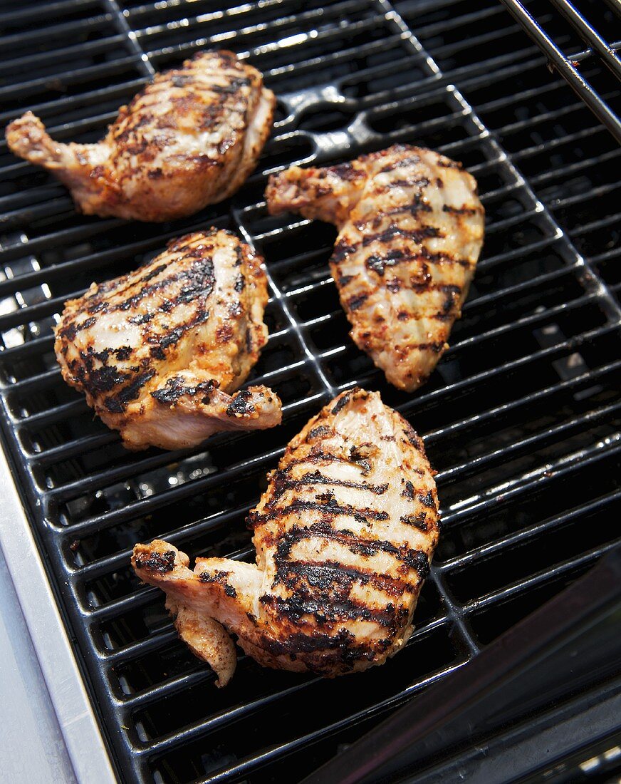 Ginger-marinated chicken breast on a grill