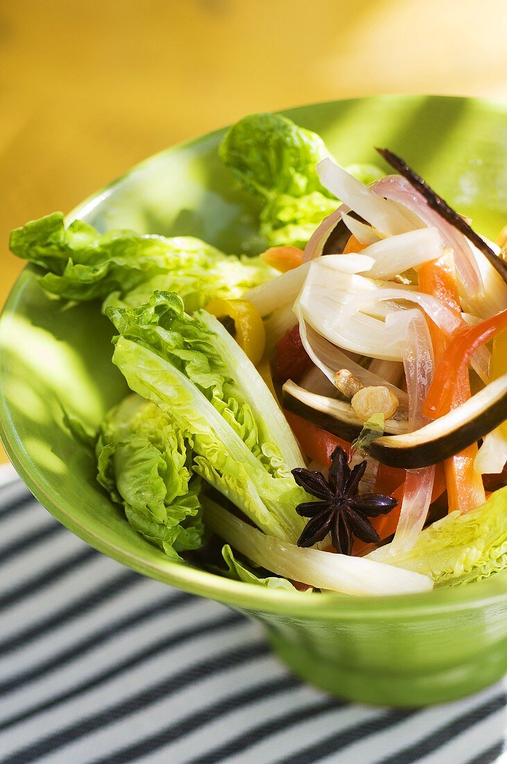 Lettuce with peppers, onion, mushrooms and star anise