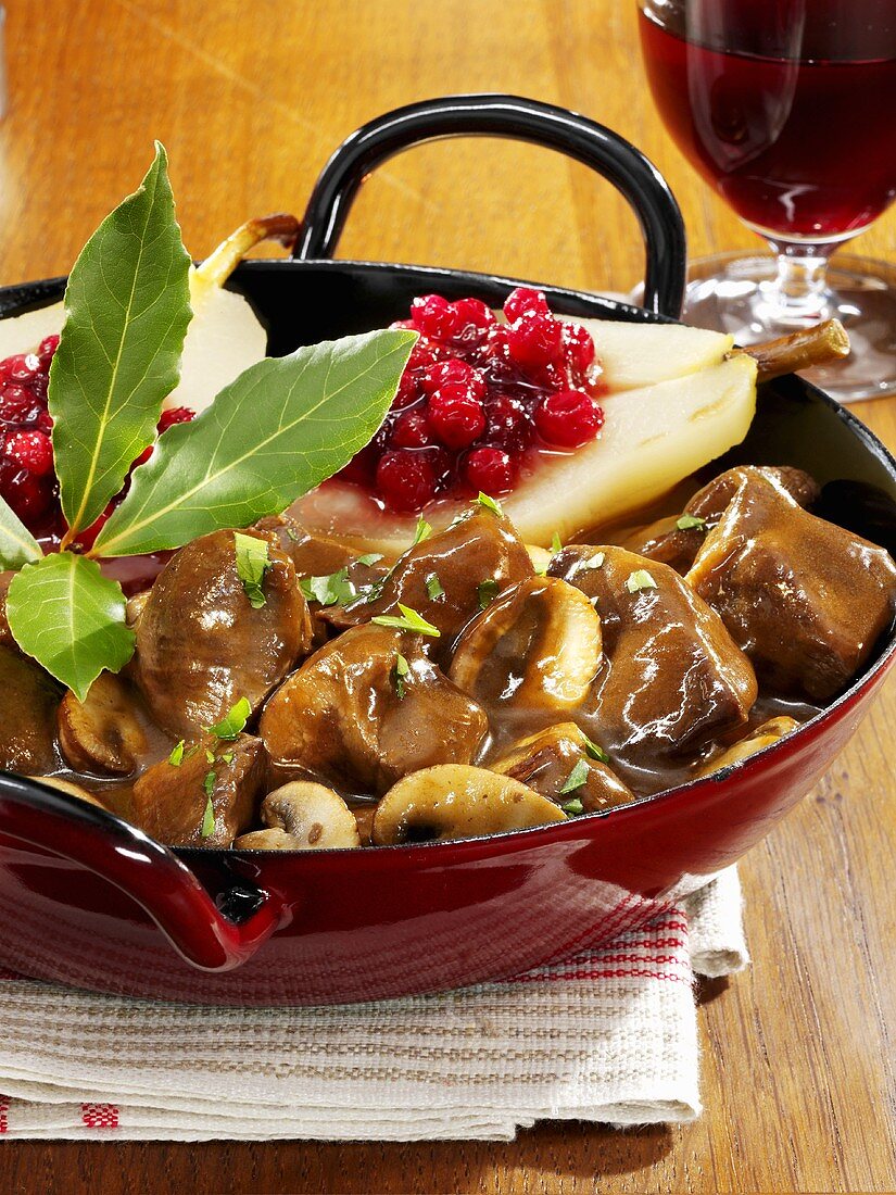Venison and mushroom ragout and pears with cranberries