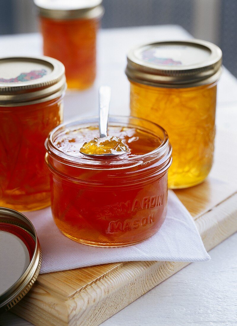 Different kinds of marmalade in jam jars