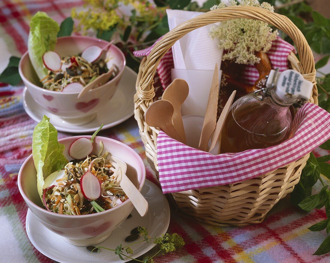 Cabbage salad on a picnic cloth with basket