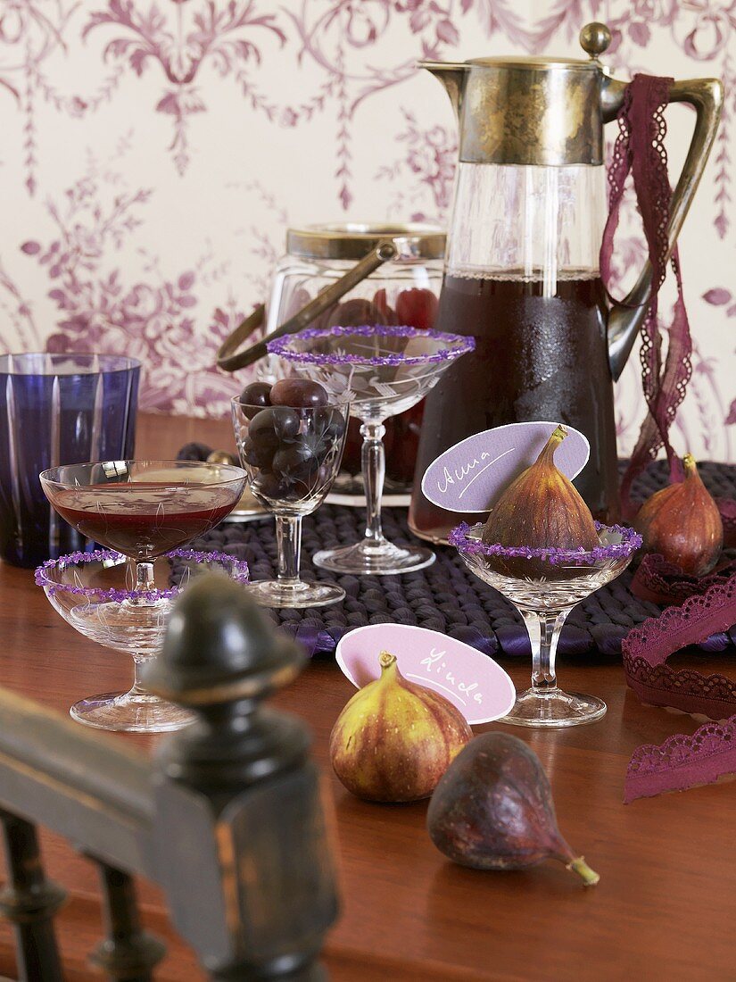 Assorted purple drinks, grapes and figs