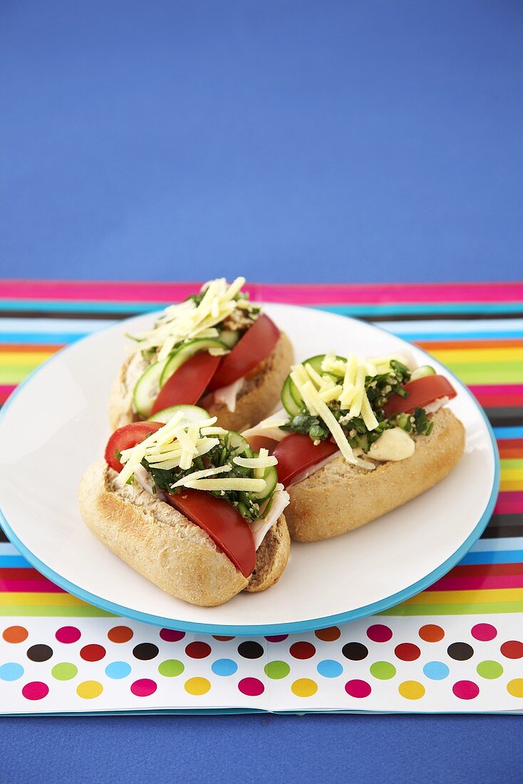 Turkey ham, tomato, herbs and cheese in three bread rolls