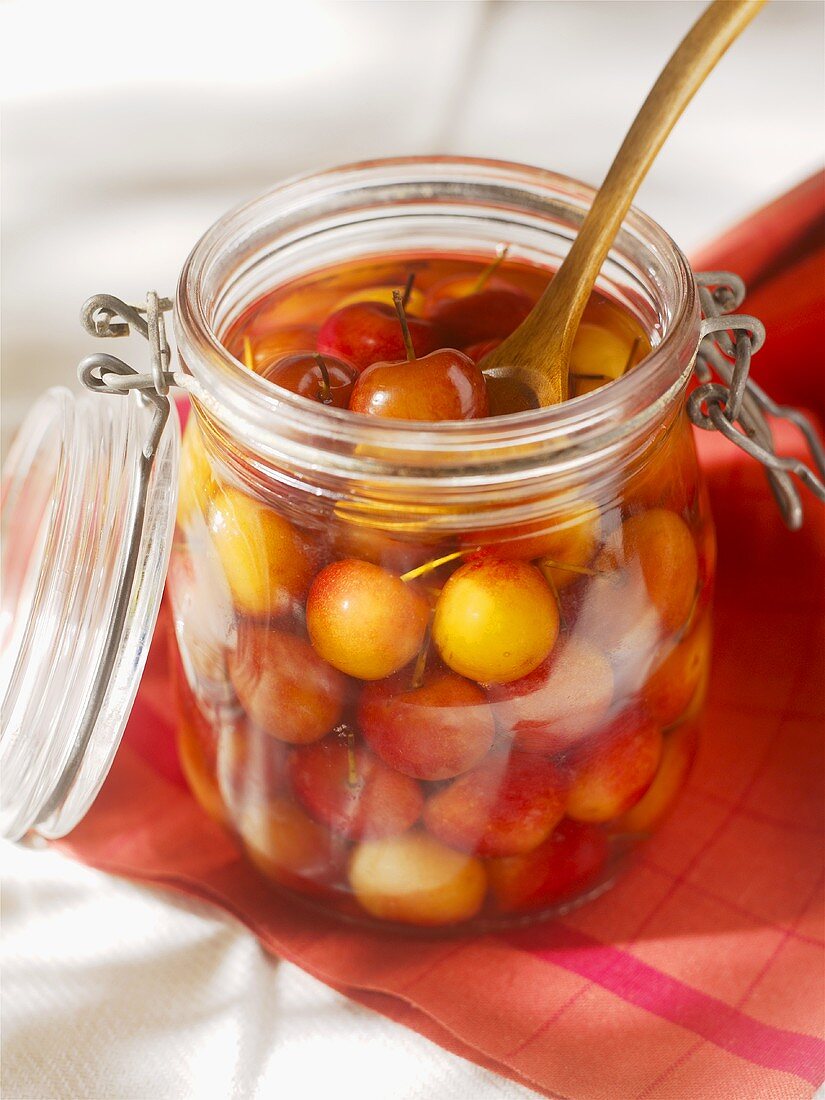 Cherries in alcohol in a preserving jar