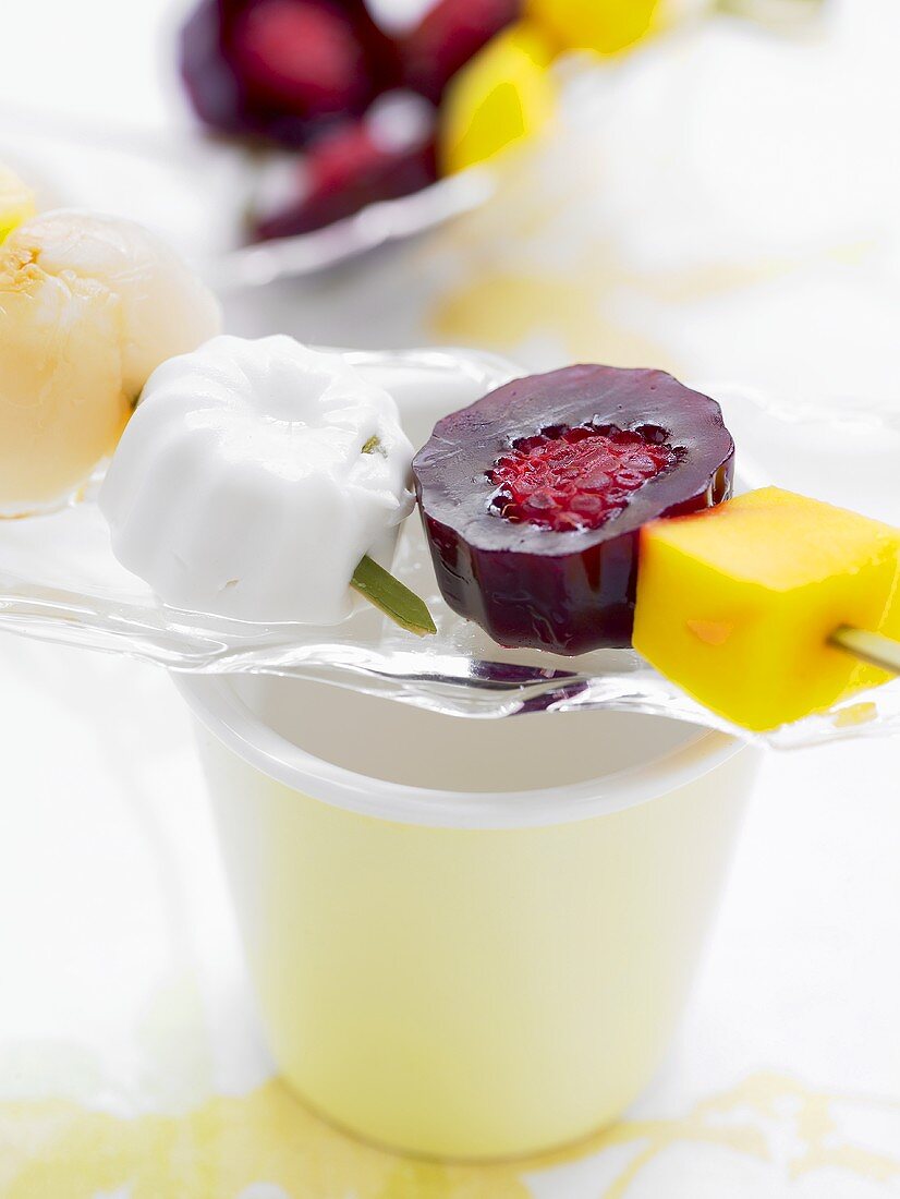 Skewered fruits in fruit jelly