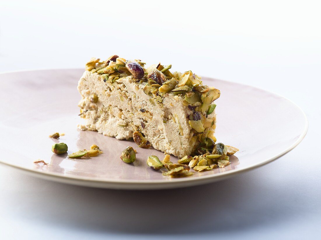 Slice of halva (Sweet made with sesame oil & pistachios, Middle East)