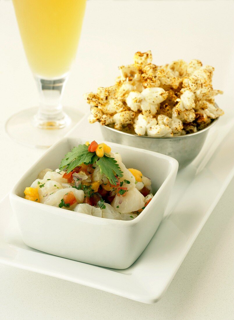 Ceviche (marinated, raw fish) and popcorn