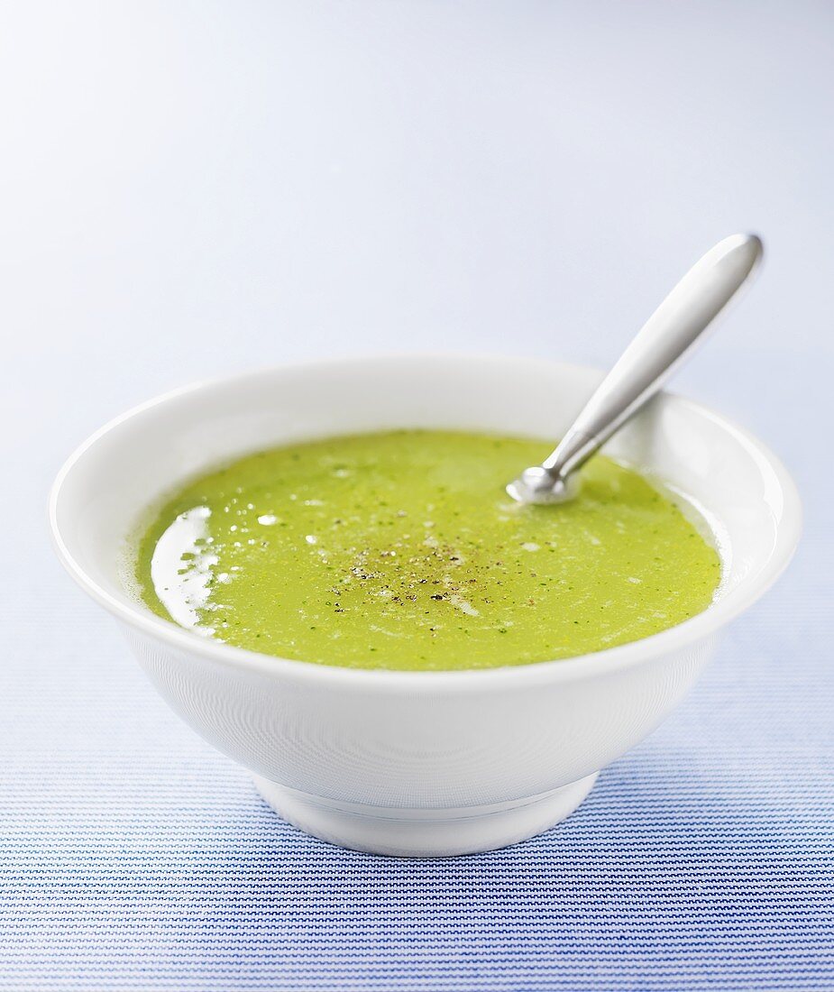 Cream of broccoli soup with spoon