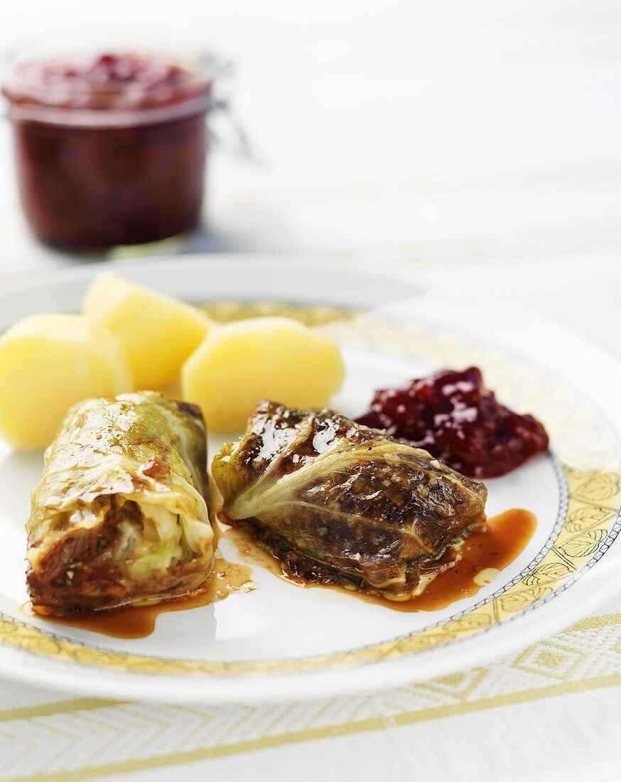 Cabbage leaves with mince stuffing, potatoes, cranberries