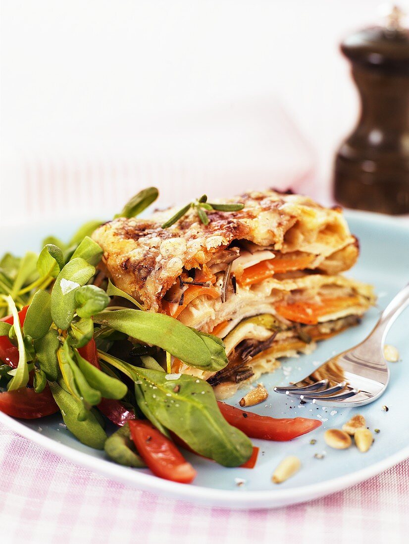 Vegetable lasagne with tomatoes and corn salad