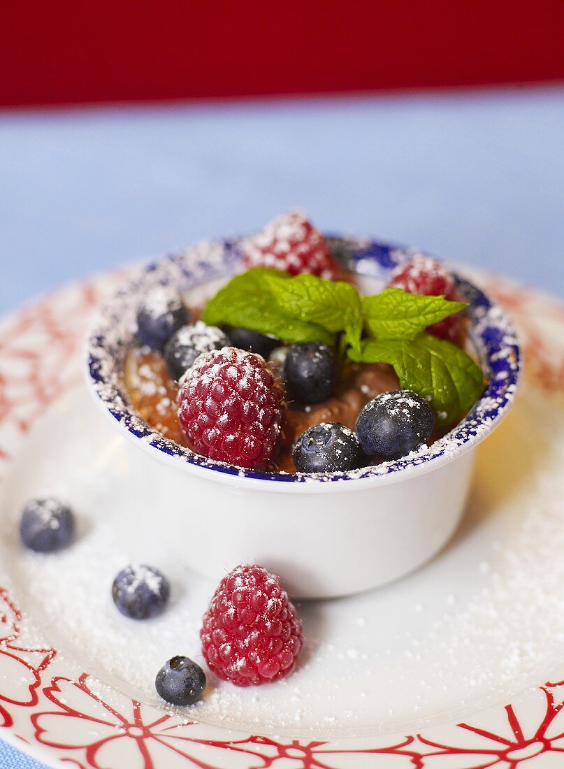 Mousse au chocolat with fresh raspberries and blueberries