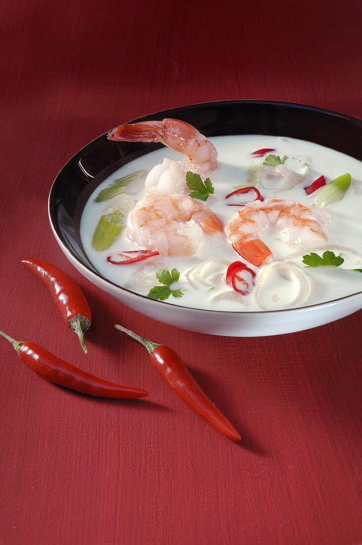 Coconut soup with prawns, spring onions and chillies
