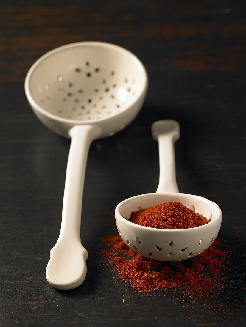 Paprika in a slotted spoon