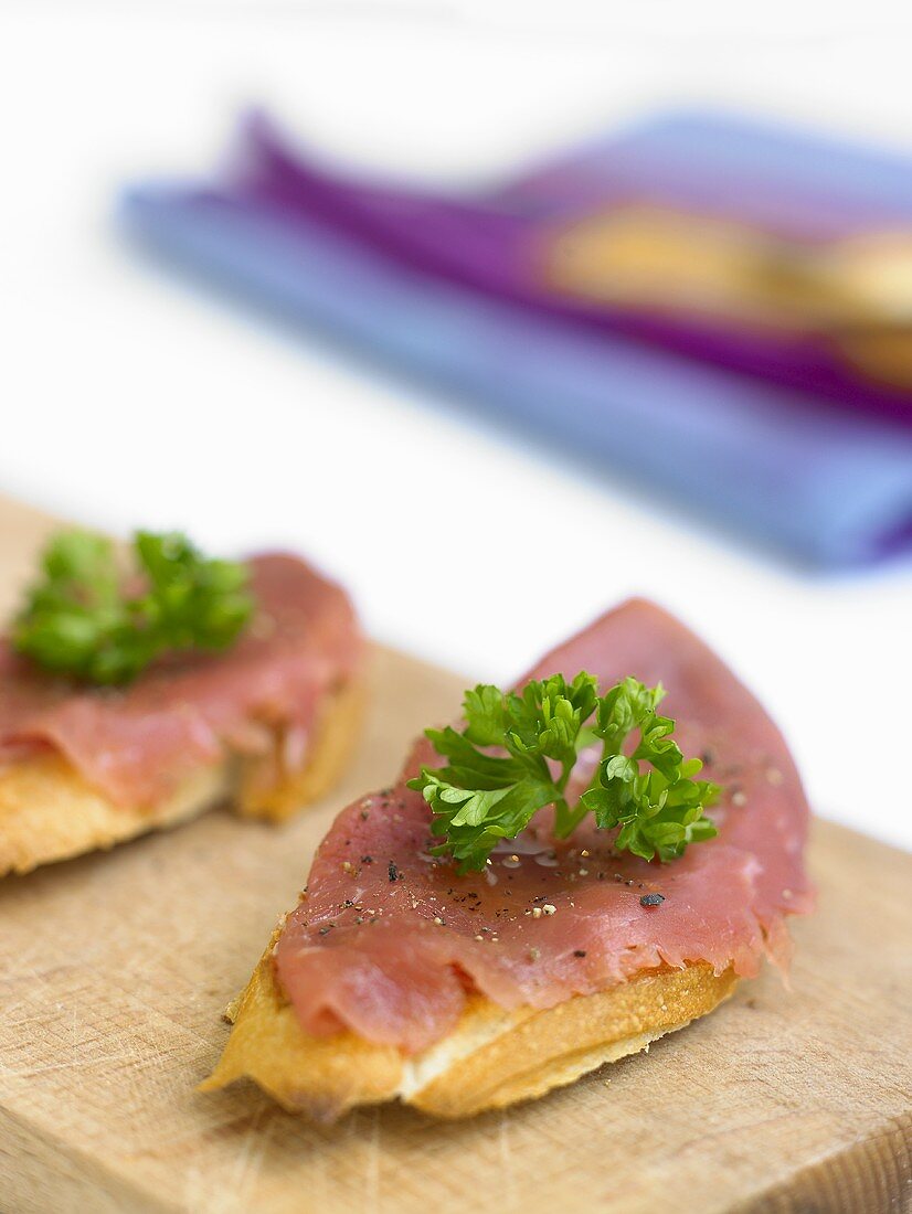Tinned salmon with shallot vinaigrette on baguette