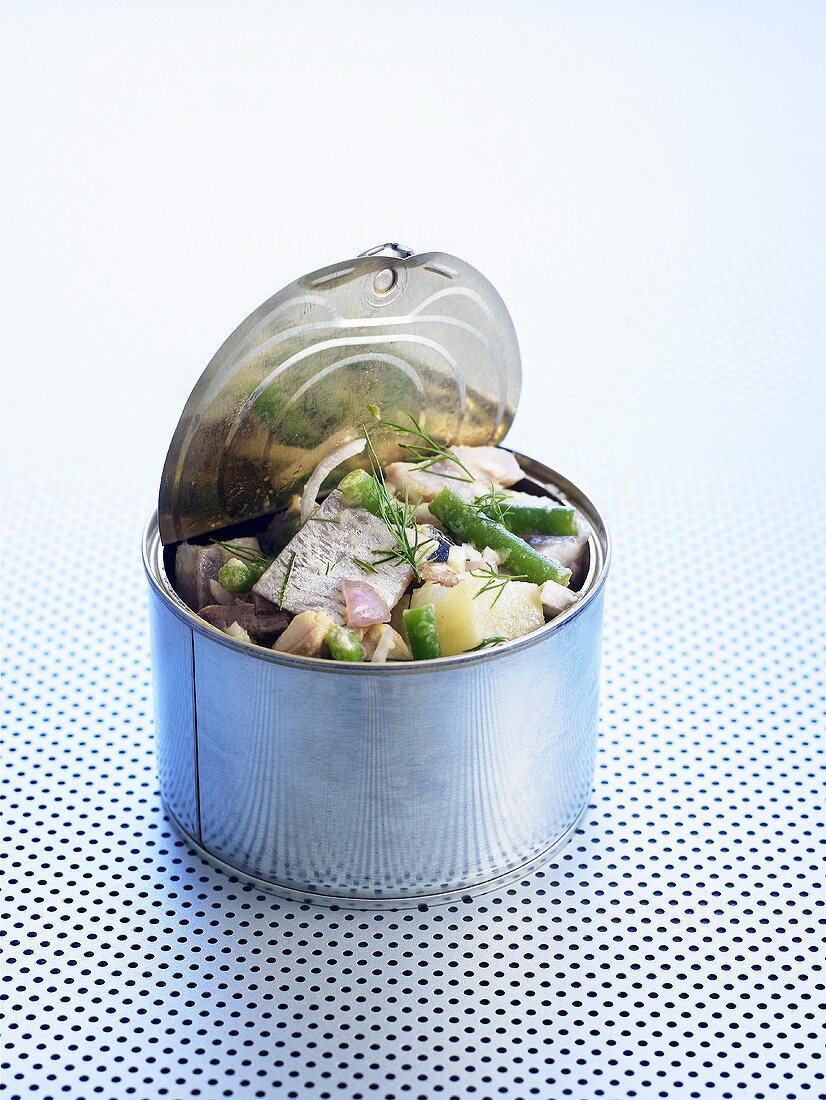 Matjes herring, potato and bean salad in a tin
