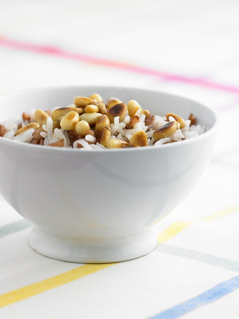 A bowl of rice with caramelised pine nuts