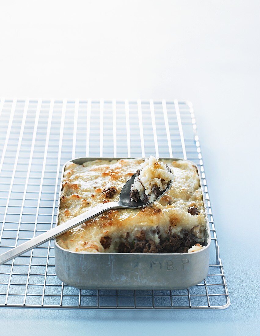 Hachis Parmentier with hazelnuts in a roasting tin