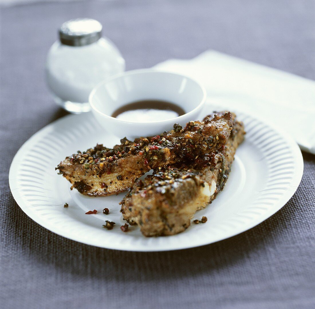 Pork ribs in pepper crust with soy sauce