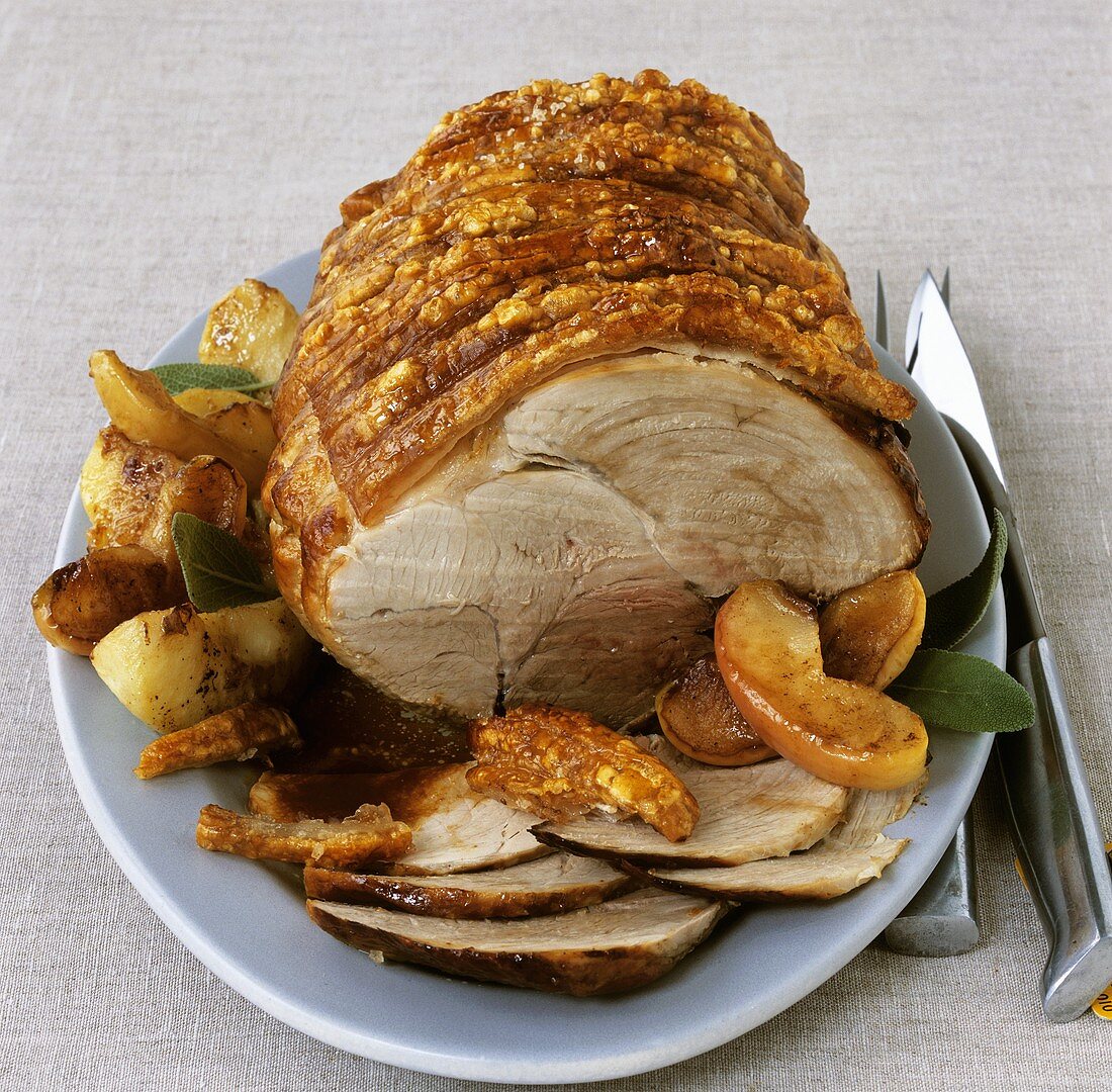 Roast pork with crackling with apples and sage