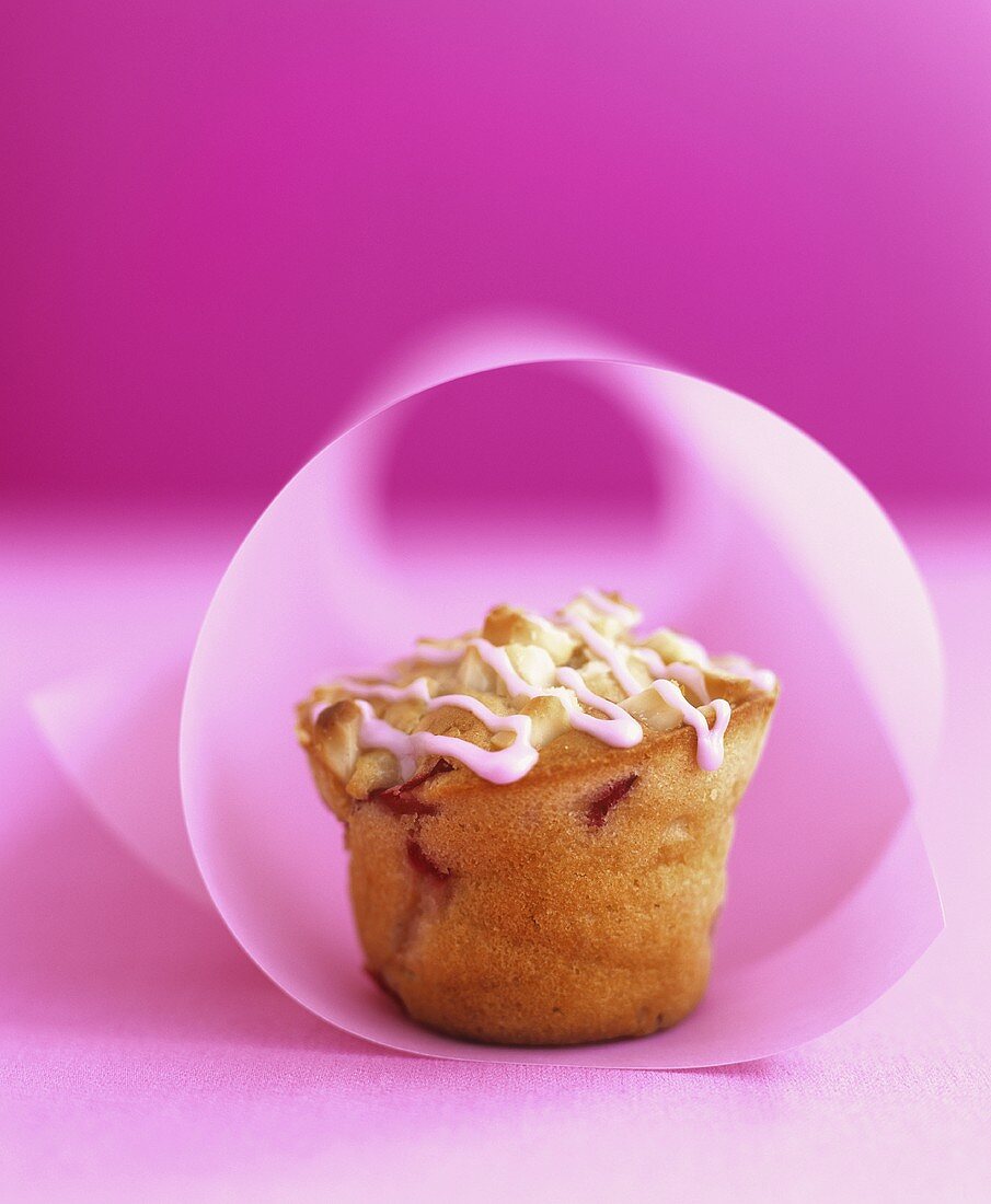 Plum muffin with nuts and icing