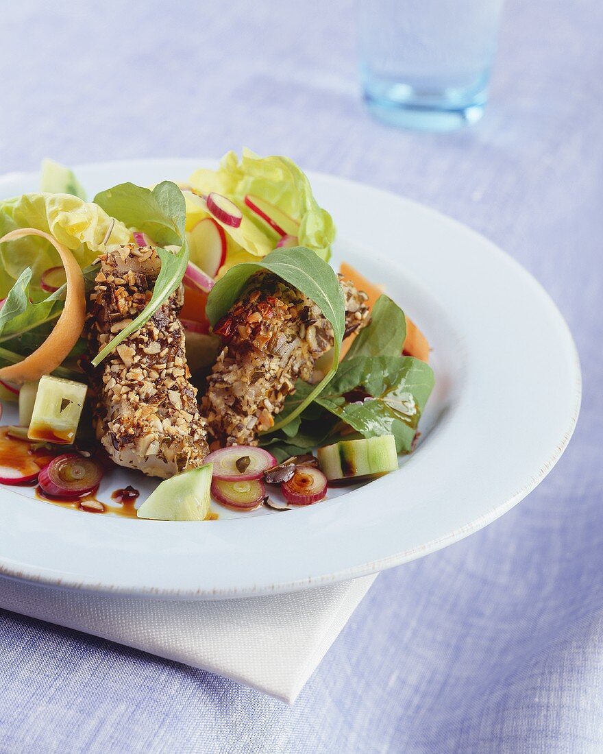 Fish fingers in pumpkin seed crust with mixed salad