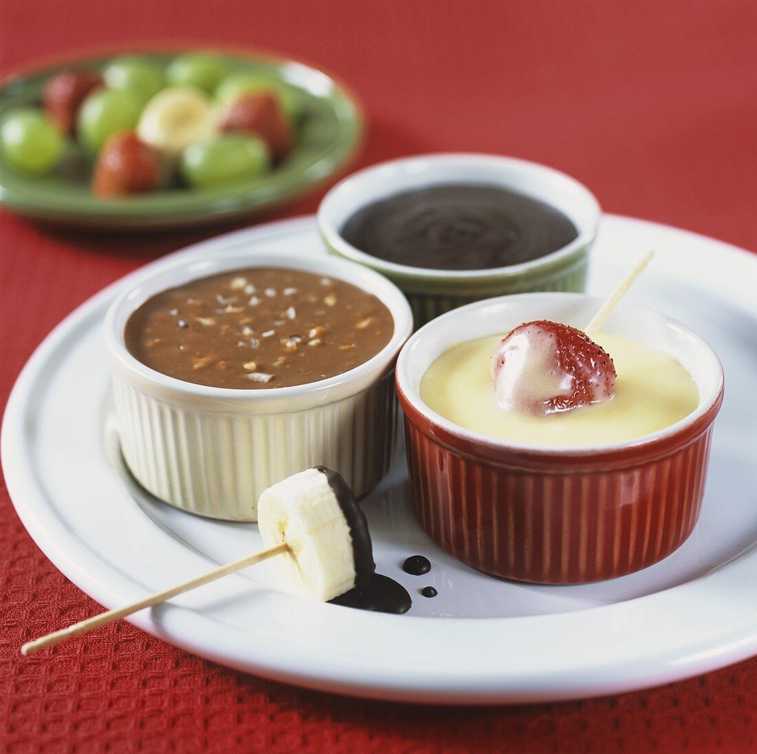 Chocolate fondue made with different chocolates, with fruit