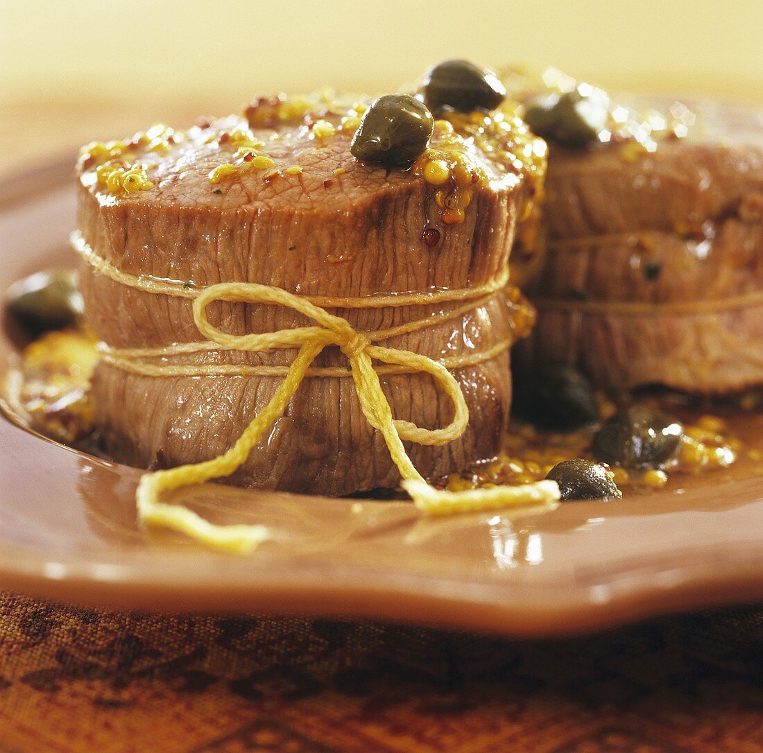 Pork medallions with caper and mustard sauce