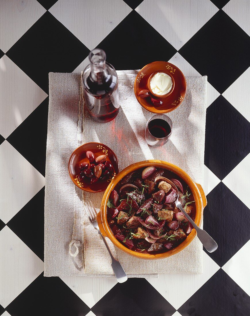 Offal and onion stew with olives and red wine, Portugal