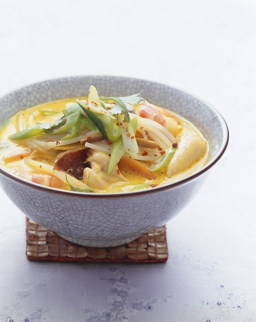 Coconut curry soup with prawns and vegetables