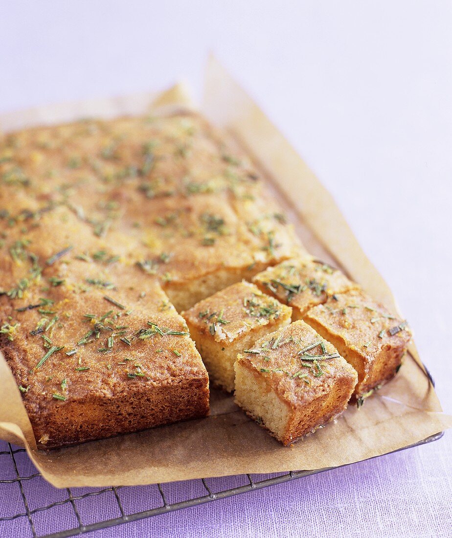 Lemon and rosemary cake on a wire rack