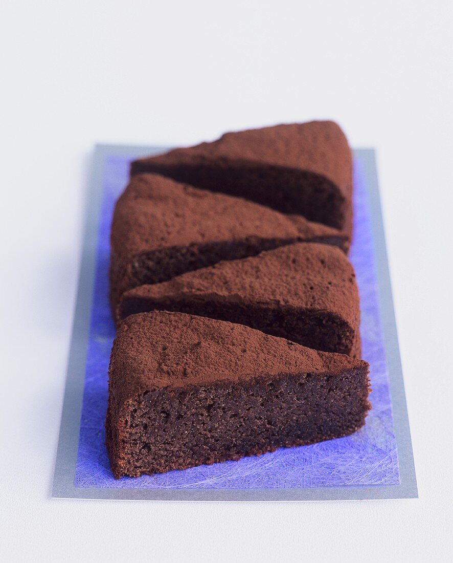 Four pieces of flourless chocolate cake