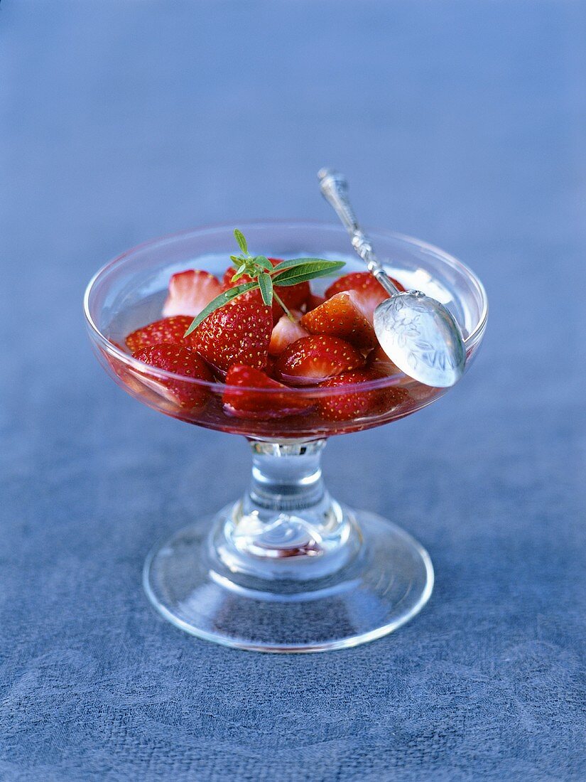 Strawberry salad with verbena in trifle glass