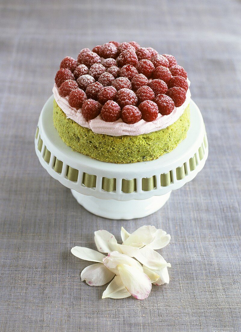 Pistachio cake with rose cream and raspberries