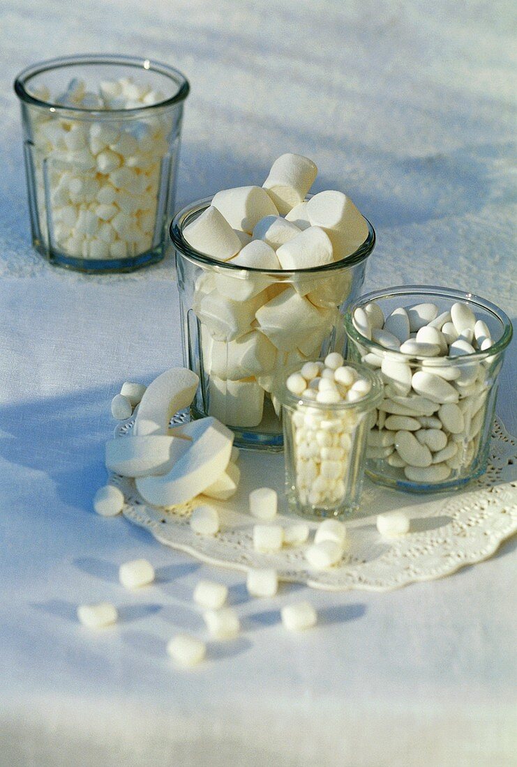Assorted white sweets in glasses