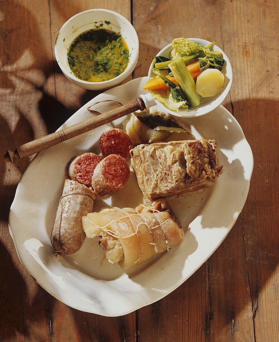 Boiled meat and sausage with salsa verde and vegetables